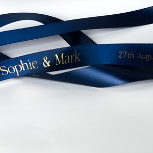 navy blue satin ribbon with gold letters printed