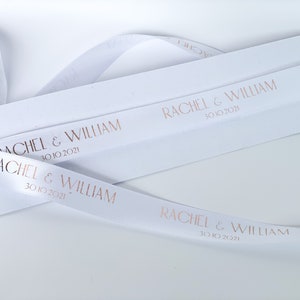 white satin ribbon with gold print