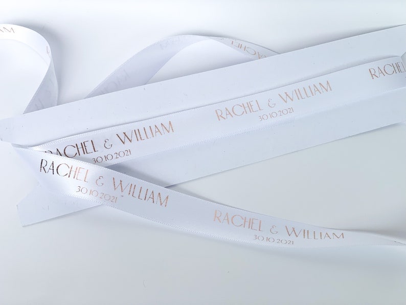 white satin ribbon with gold print