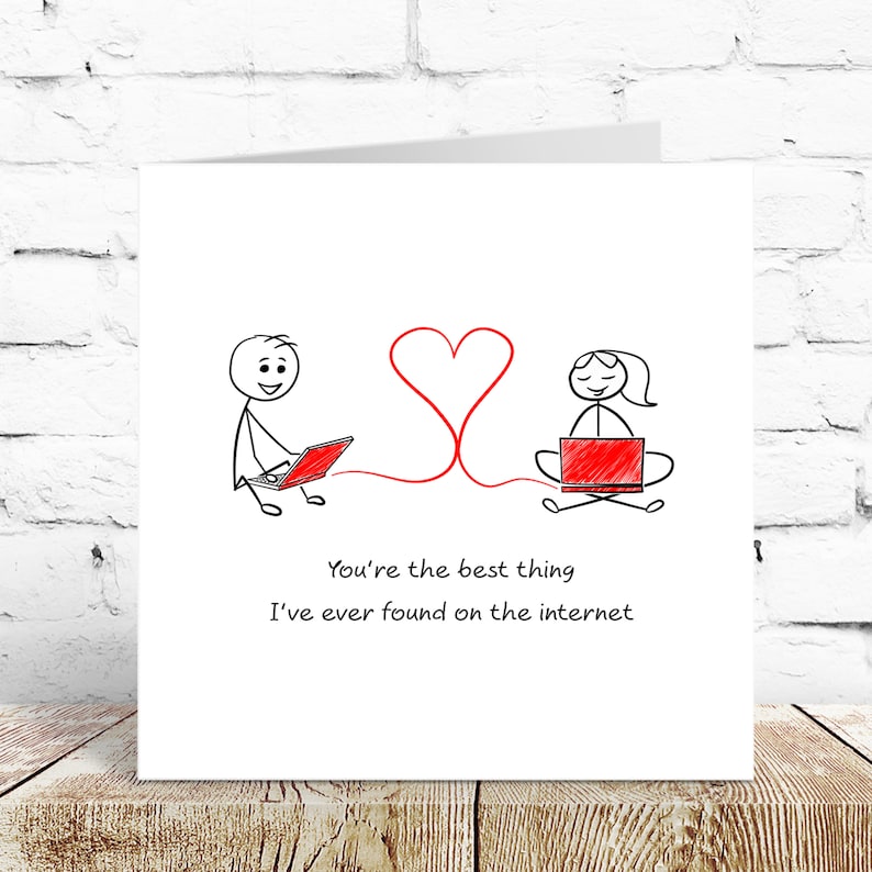 May include: A greeting card with a stick figure illustration of two people on laptops connected by a red heart. The text reads "You're the best thing I've ever found on the internet."