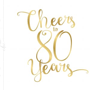May include: Gold foil calligraphy script reads "Cheers to 80 Years".