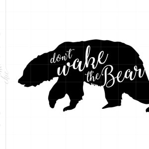 May include: Black silhouette of a bear with the text "don't wake the bear" written in white cursive lettering.