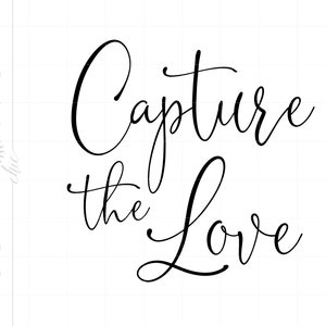 May include: Black and white calligraphy text that reads "Capture the Love".