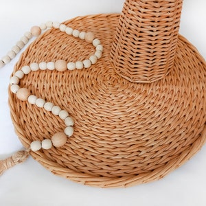 Boho placemat table decor. Woven round rattan natural beige colour coaster for wicker home decor.