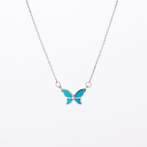 May include: A silver chain necklace with a blue opal butterfly pendant.