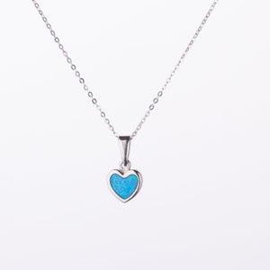 May include: A silver chain necklace with a small heart pendant featuring a blue opal gemstone.