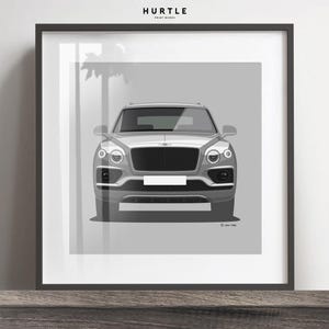 May include: Framed print featuring a gray illustration of a luxury SUV. The artwork is a front view of the vehicle, showcasing its headlights, grille, and bumper. The print is set against a light gray background and framed in black. The text "HURTLE PRINT WORKS" is at the top.