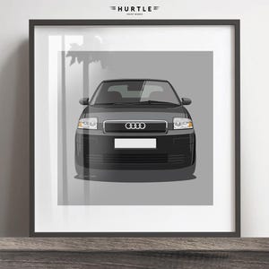 May include: A black Audi A2 with a gray background. The car is facing the camera and the front grill is visible. The Audi logo is visible on the front grill.