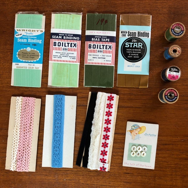 Miscellaneous vintage sewing notions and supplies: thread, ribbon, buttons, seam binding, bias tape