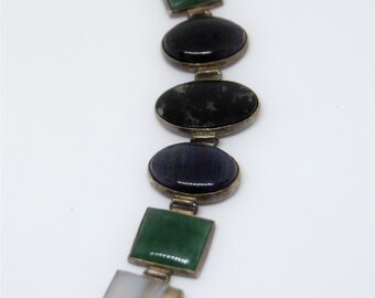 Preciosa pulsera llamativa Art Déco con impresionantes piedras semipreciosas de lapislázuli ovaladas y cuadradas.