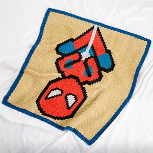 Motif de couverture au crochet Spider C2C de 66 x 66 blocs - Jeté de super-héros à suspendre à l'envers - Cadeau pour bébé de style bande dessinée - Pixel Graph Télécharger le PDF
