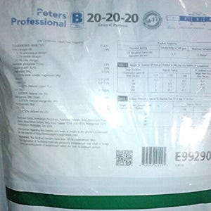May include: A bag of Peters Professional 20-20-20 General Purpose water-soluble fertilizer. The bag is white with green and blue accents. Text includes the product name, fertilizer analysis, and other product information.