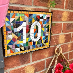 Custom mosaic door number plaques with all colours of the rainbow orange