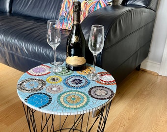Rainbow circles in blue background mosaic table  with basket for storage