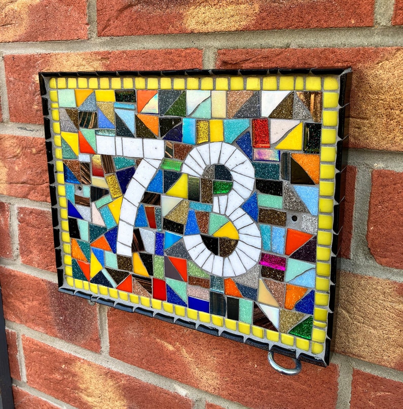 Custom mosaic door number plaques with all colours of the rainbow yellow