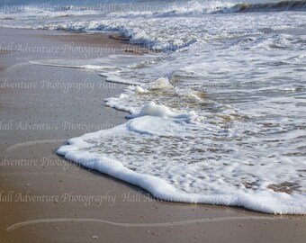 Waves crashing into the Sand