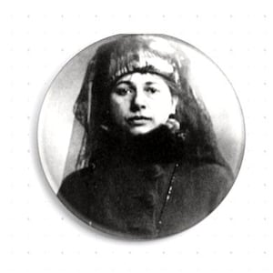 May include: Black and white portrait of a woman wearing a veil and a dark dress.