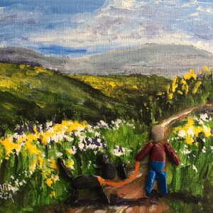 May include: A painting of a person walking a dog on a path through a field of yellow flowers. The person and dog are made of small stones. The background is a green field with a mountain in the distance.