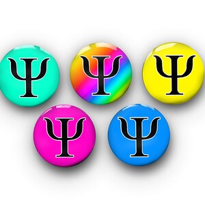 May include: Five round buttons with the Greek letter psi in black on a variety of colored backgrounds. The buttons are turquoise, rainbow, yellow, pink, and blue.