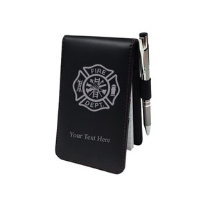 May include: Black leather notepad with a silver pen and a silver firefighter emblem with the text "FIRE DEPT." and "Your Text Here".