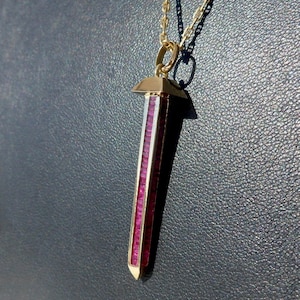 Porte-bonheur / pendentif vintage en forme de fer à cheval, or 18 carats, années 60