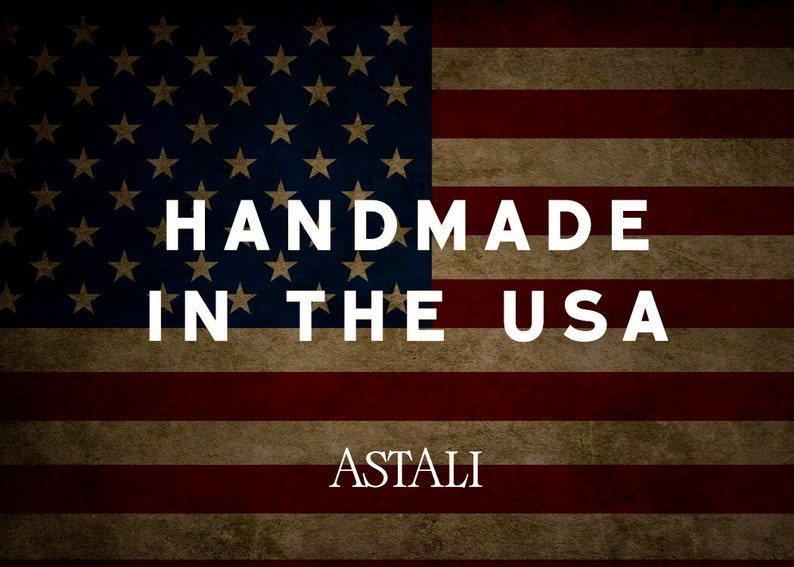 May include: A vintage-style American flag with the text "HANDMADE IN THE USA" and the word "ASTALI" below it.
