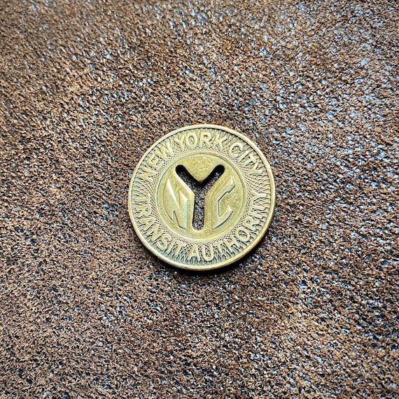 One (1) New York Subway Token, Large Y Cut-out, Quarter Size or