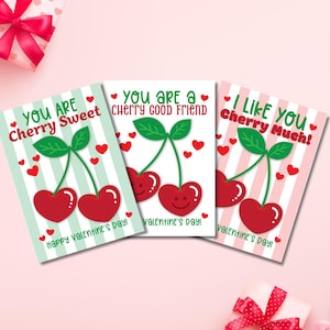 May include: Three Valentine's Day cards with cherry illustrations. Each card features a cherry design with a different message: "You are Cherry Sweet," "You are a Cherry Good Friend," and "I Like You Cherry Much!" The cards have striped backgrounds.