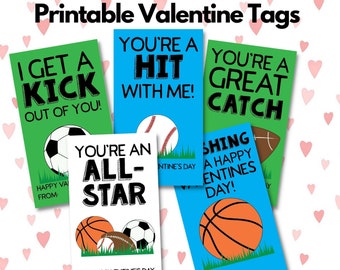 May include: Four printable Valentine's Day tags featuring sports-themed designs. The tags feature a soccer ball, baseball, basketball, and football with various phrases such as "I get a kick out of you!" and "You're a hit with me!"