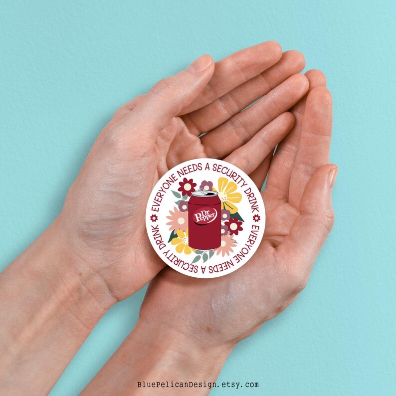 May include: A round sticker with a white background and a red Dr Pepper can surrounded by colorful flowers. The text around the can reads "Everyone needs a security drink" in a circular pattern.