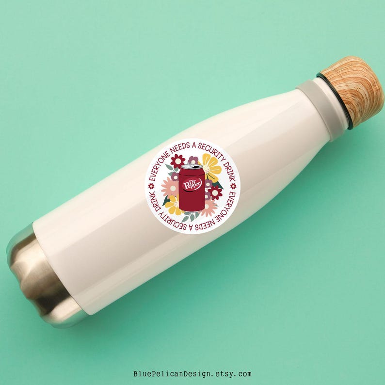May include: White stainless steel water bottle with a round sticker that says "Everyone needs a security drink. Everyone needs a security drink." with a Dr Pepper can and flowers in the center.