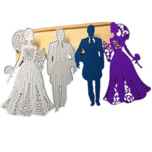 Puede incluir: Troqueles met&aacute;licos de una novia y un novio con atuendo de boda. La novia lleva un vestido blanco con detalles intrincados y un tocado floral. El novio lleva un traje con pajarita. Los troqueles son de color plateado.