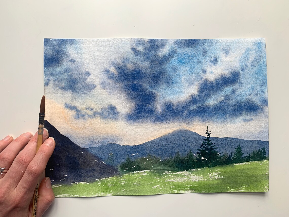 Original watercolour painting mountains clouds grass sunset Etsy