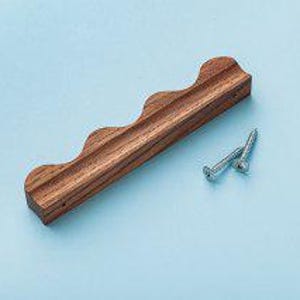 May include: A wooden cabinet pull with a wavy design. The pull is brown and has a natural wood finish. Two silver screws are included.