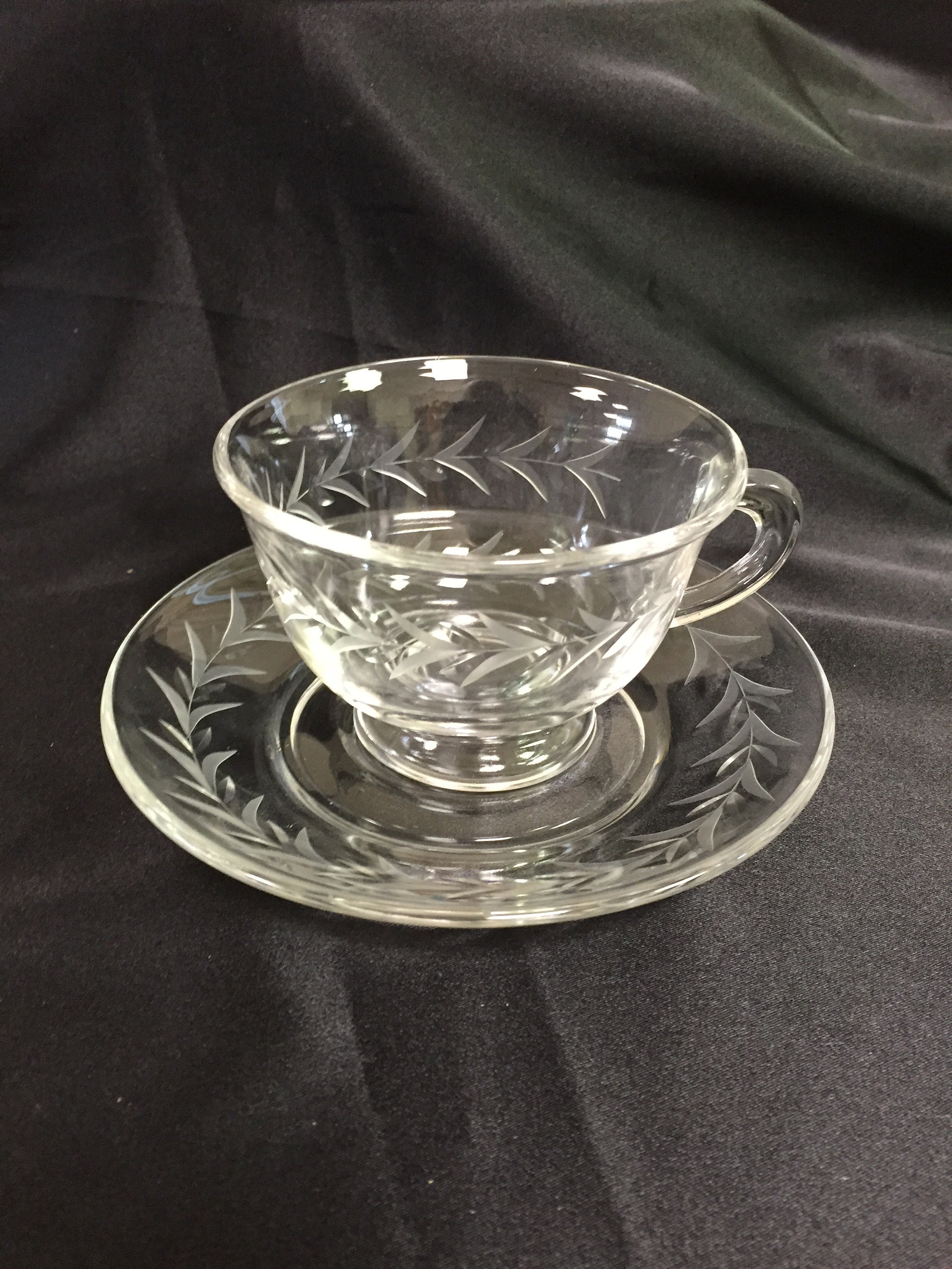 Four Cups 2 3/8 footed and Saucers from Etsy