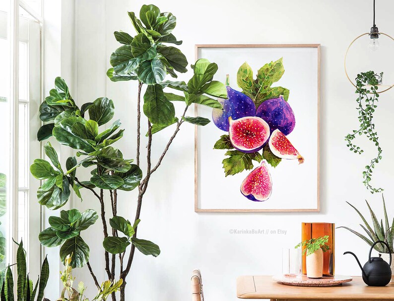 May include: Watercolor painting of a bunch of purple and pink figs with green leaves. The painting is framed and hanging on a white wall.