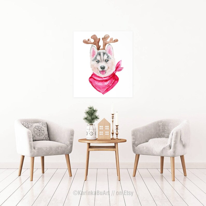 May include: Watercolor painting of a husky dog wearing a red bandana and reindeer antlers. The dog is looking at the viewer with a happy expression.