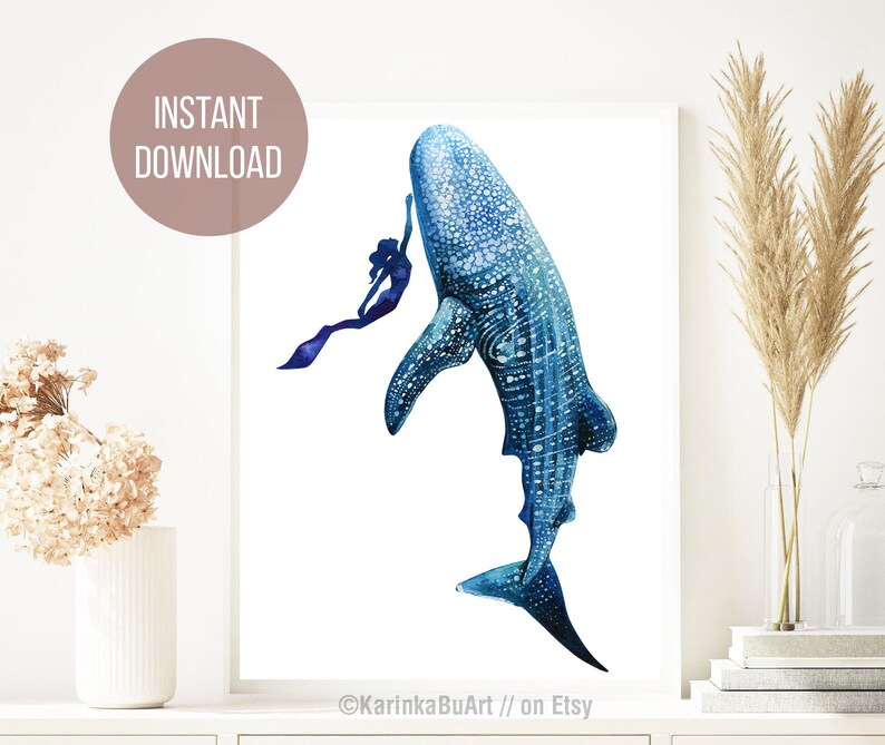 May include: Watercolor painting of a blue whale shark with a mermaid swimming next to it. The painting is on a white background and has a blue and purple color scheme.