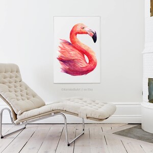 May include: A watercolor painting of a pink flamingo with a long neck and a curved beak. The flamingo is standing on one leg and its wings are spread out. The painting is on a white background.