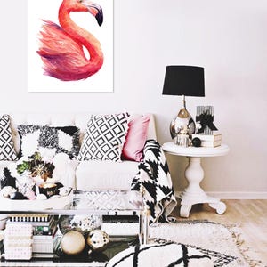 May include: A watercolor painting of a pink flamingo with a white background. The flamingo is in a standing position with its head turned to the side. The painting is framed and hanging on a white wall.