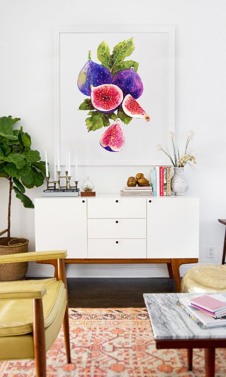 May include: A framed watercolor painting of a bunch of purple figs with green leaves. The painting is hanging on a white wall above a white dresser with a yellow chair in front of it.
