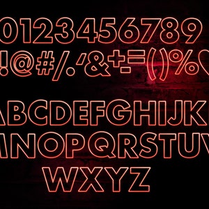 May include: Red neon sign displaying the numbers 0-9, punctuation marks, and the alphabet in a bold, blocky font. The sign is on a dark brick wall.