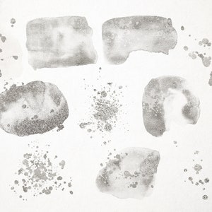 May include: A set of silver watercolor paint splatters and washes on a white background. The splatters are various sizes and shapes, and the washes are irregular and organic.
