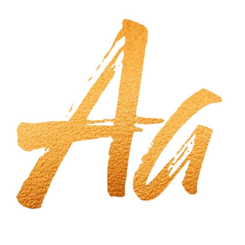 May include: Gold foil brush lettering of the letter "A" in uppercase and lowercase.