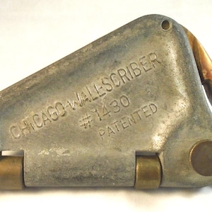 Chicago wall scriber, used for cutting wallpaper and linoleum to fit irregular surfaces for custom appearance.