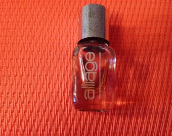 Miniature perfume from Estee Lauder alloy