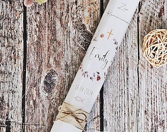 May include: White communion candle with a floral design, the name "Emily" and the date "06.04.2024". The candle also has a cross and a fish symbol.