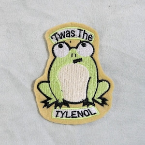 May include: A set of three ceramic mugs with a speckled, cream-colored glaze. Each mug features a different hand-painted floral design in shades of blue, green, and yellow. The mugs have a simple, rounded shape and a comfortable handle.