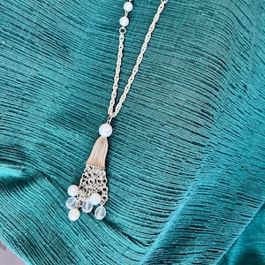Long silver necklace with faux pearls