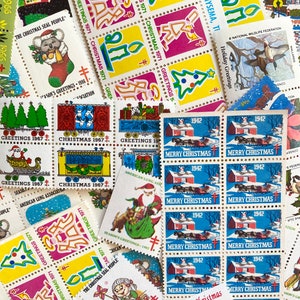 May include: A collection of vintage Christmas-themed postage stamps. The stamps feature various designs, including Christmas trees, Santa Claus, snow-covered scenes, and the text "Merry Christmas" and "Greetings 1967". The stamps are in various colors.